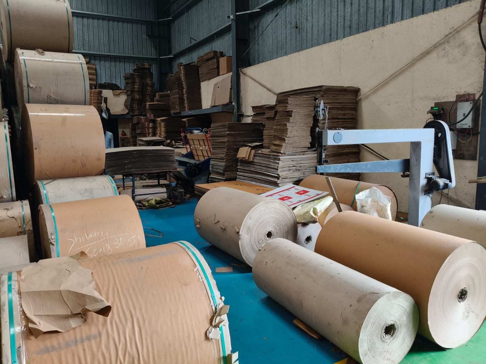 Close-up of paper rolls and machinery